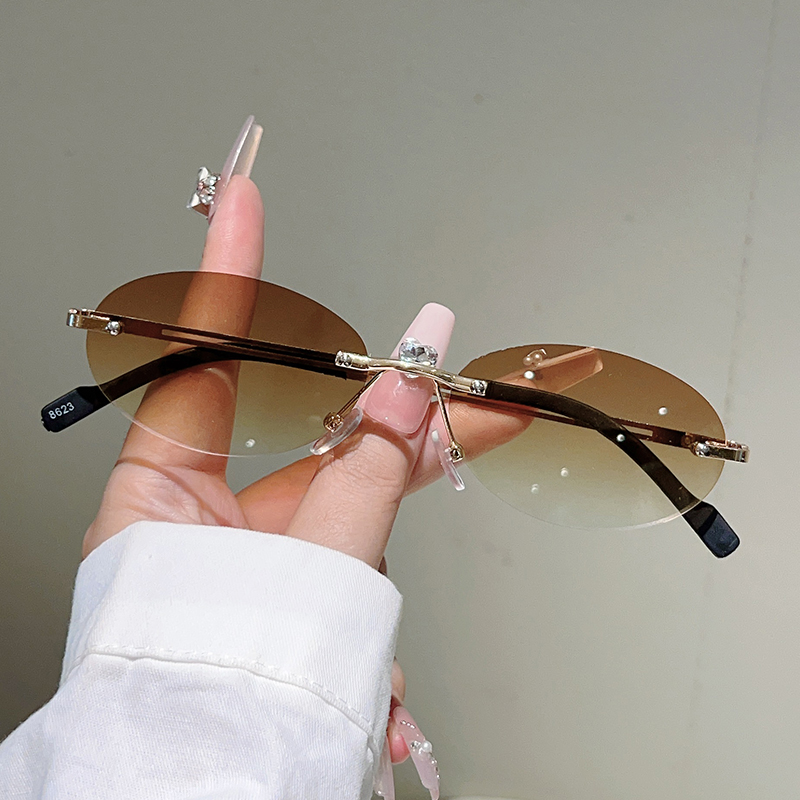 Rimless ovale zonnebrillen voo - Designer Sunglasses recensie en prijs